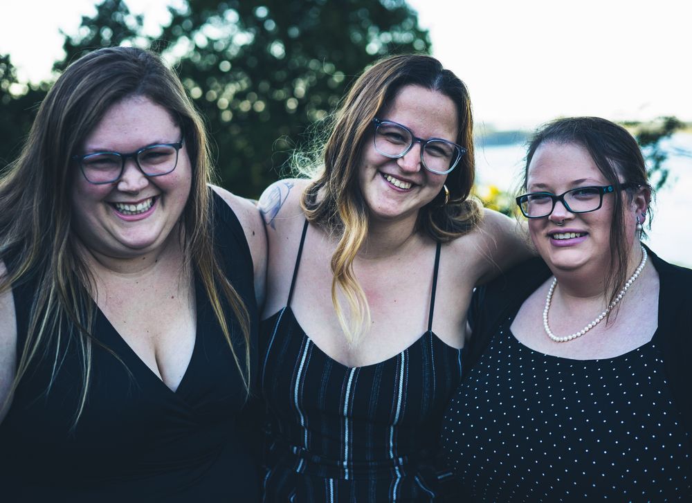 Three women smiling