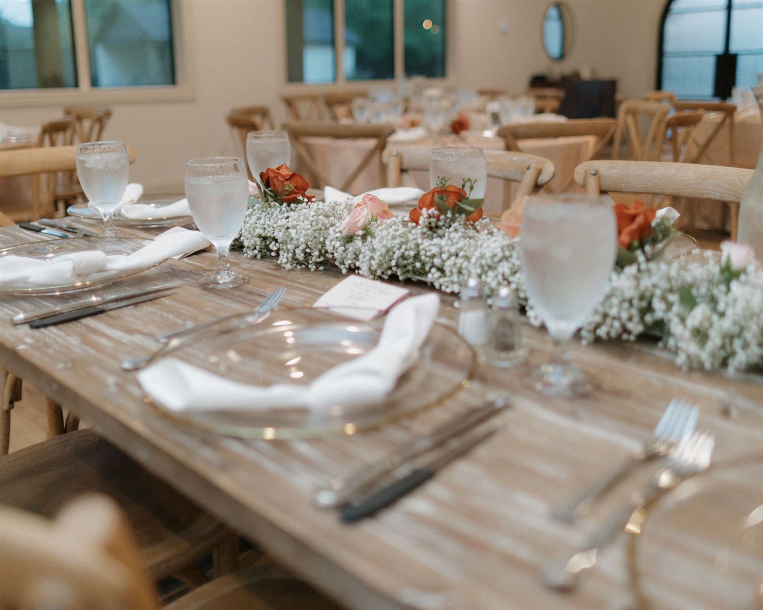 Rustic wedding table setting with delicate baby's breath centerpiece.