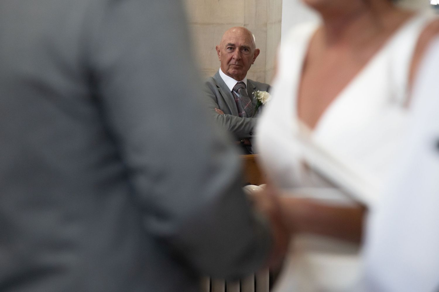 Wedding ceremony moments captured in an elegant indoor setting.