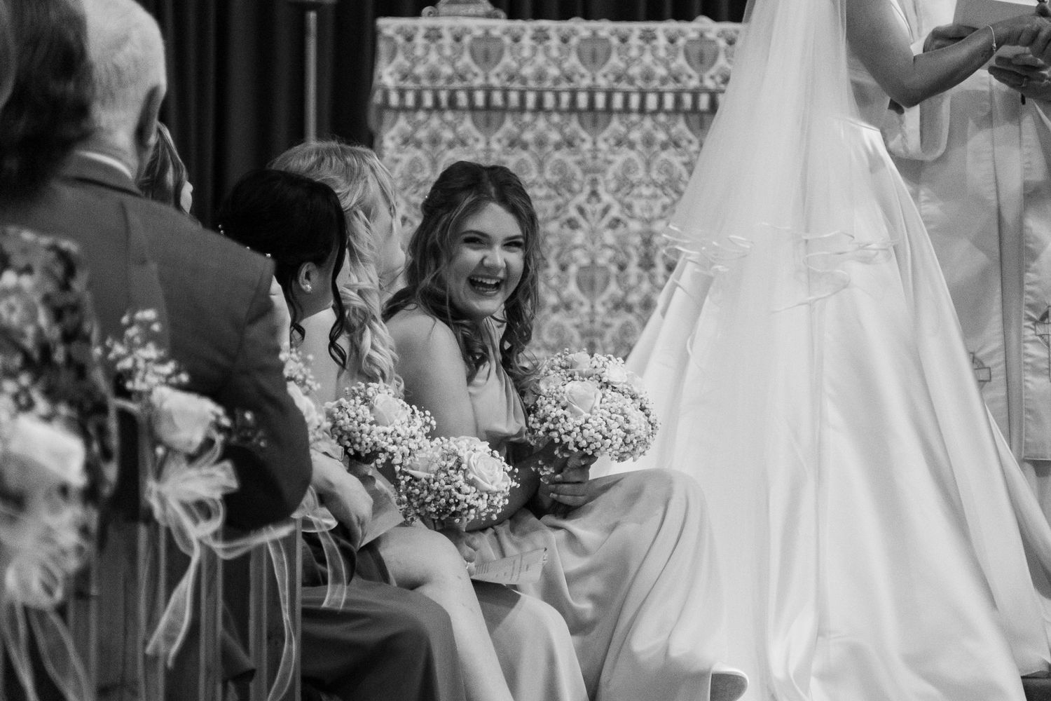 Black and white wedding ceremony shots showing emotional moments.