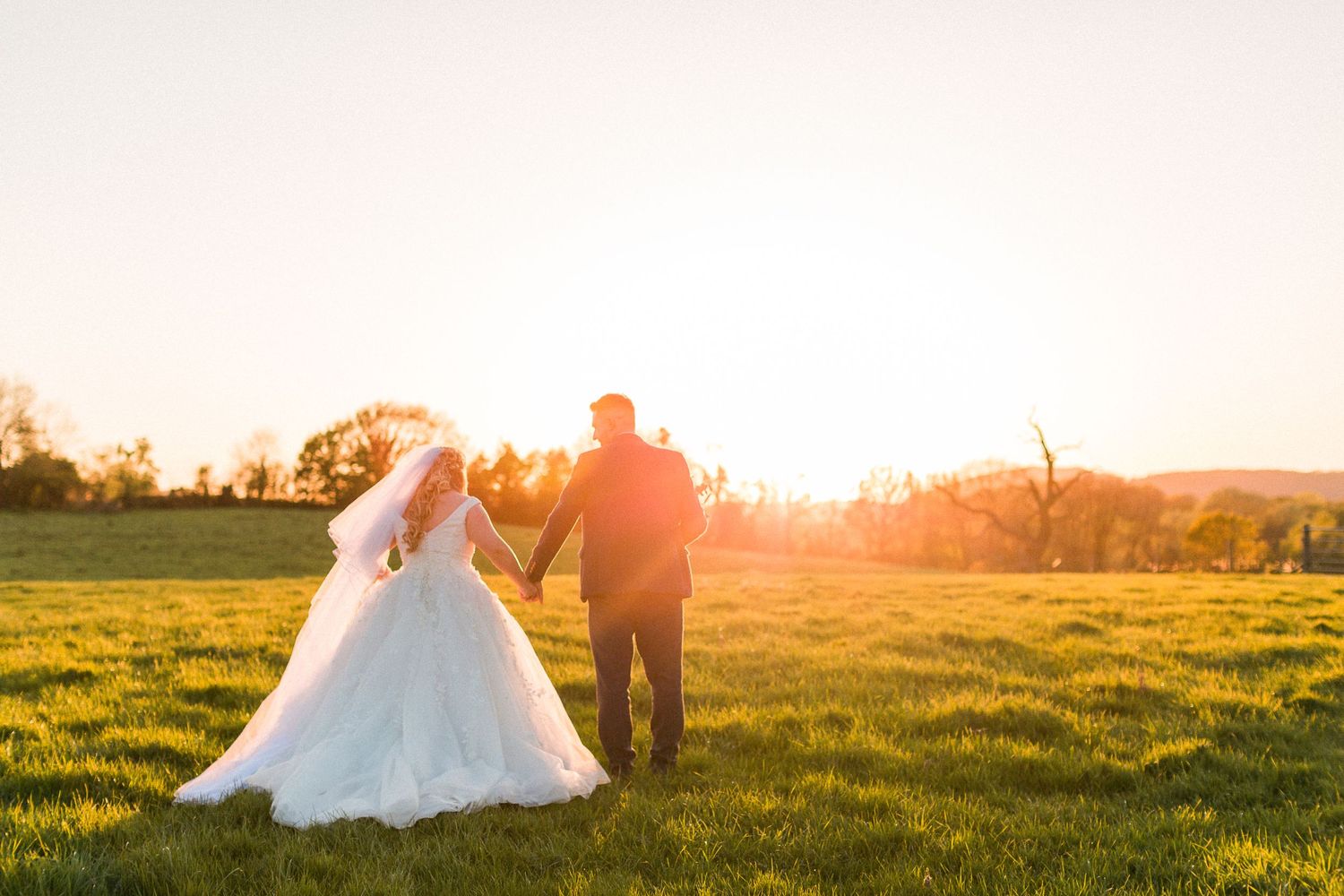 Hayley Elizabeth Wedding Photographer Curradine Barns Photography sunset field Worcestershire countryside reception