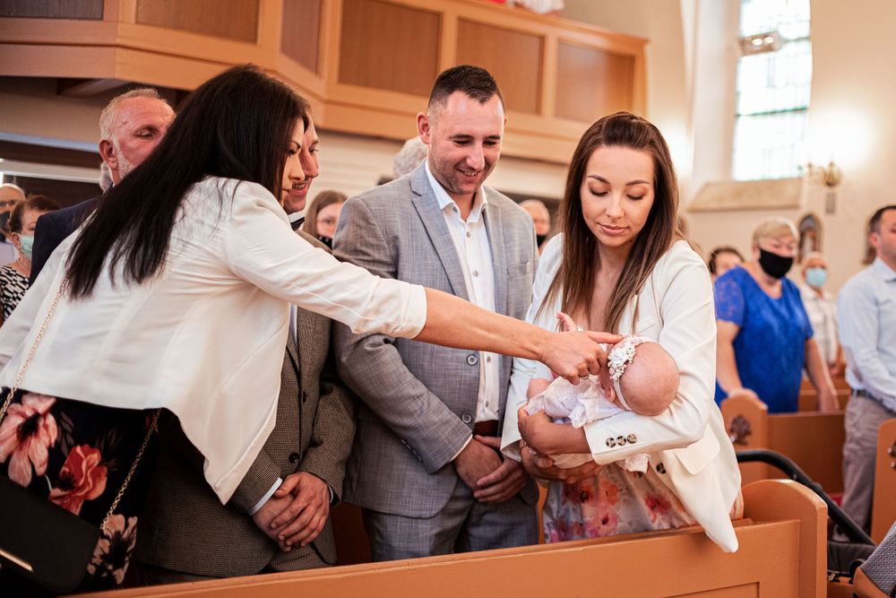 Religious ceremony taking place inside a traditional church setting.