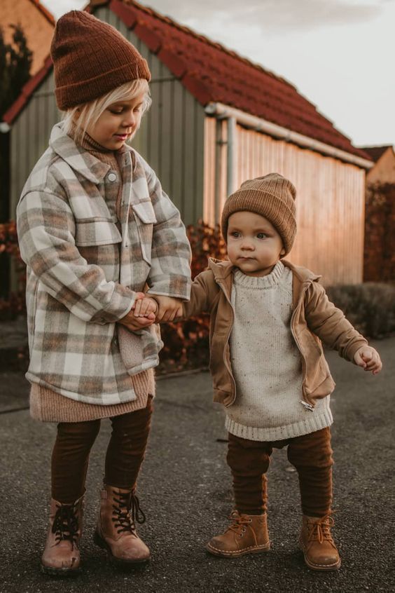 Matching autumn outfits featuring plaid shackets, knit sweaters, and brown boots.