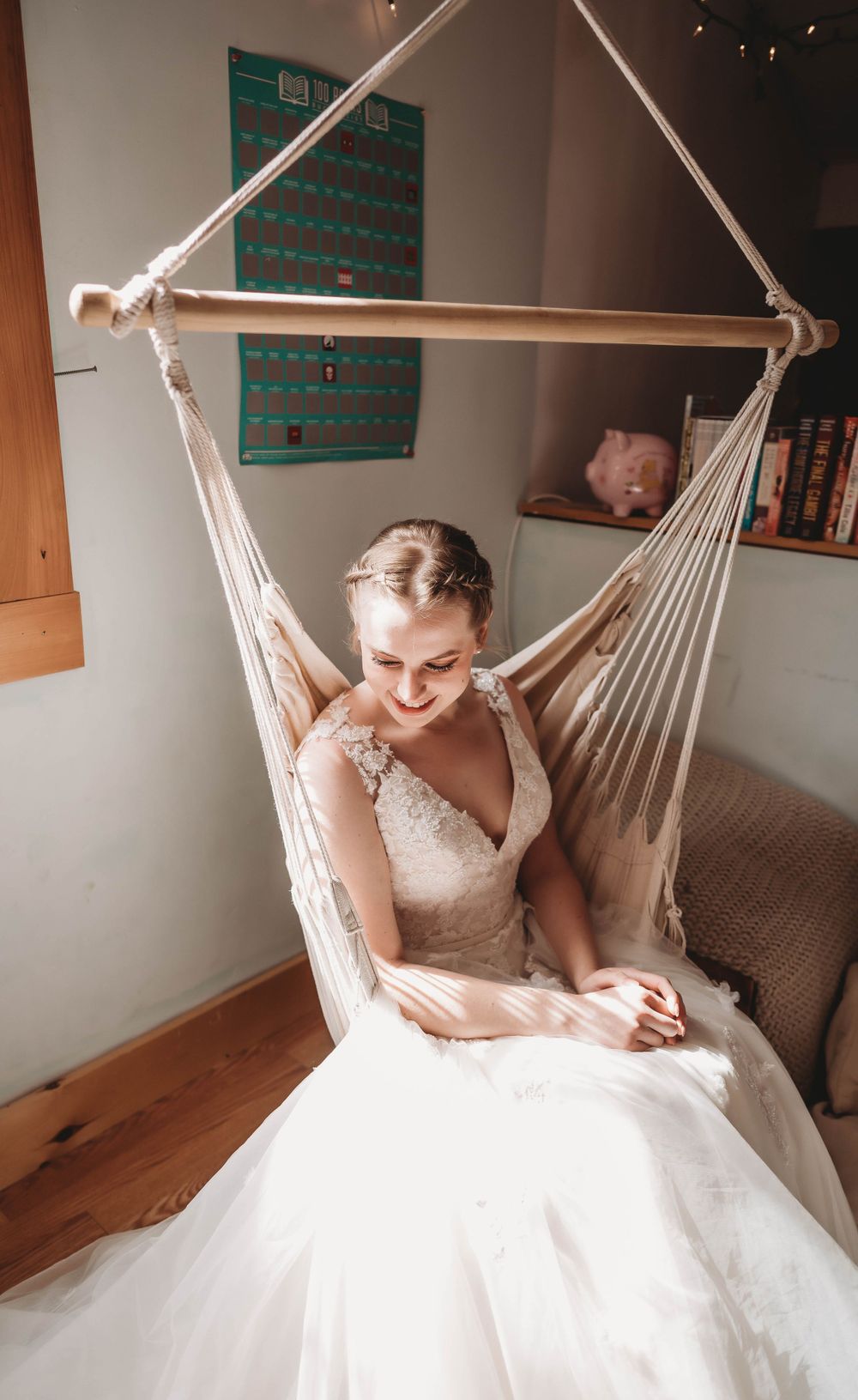 Quiet moment in a white hanging chair with natural lighting.