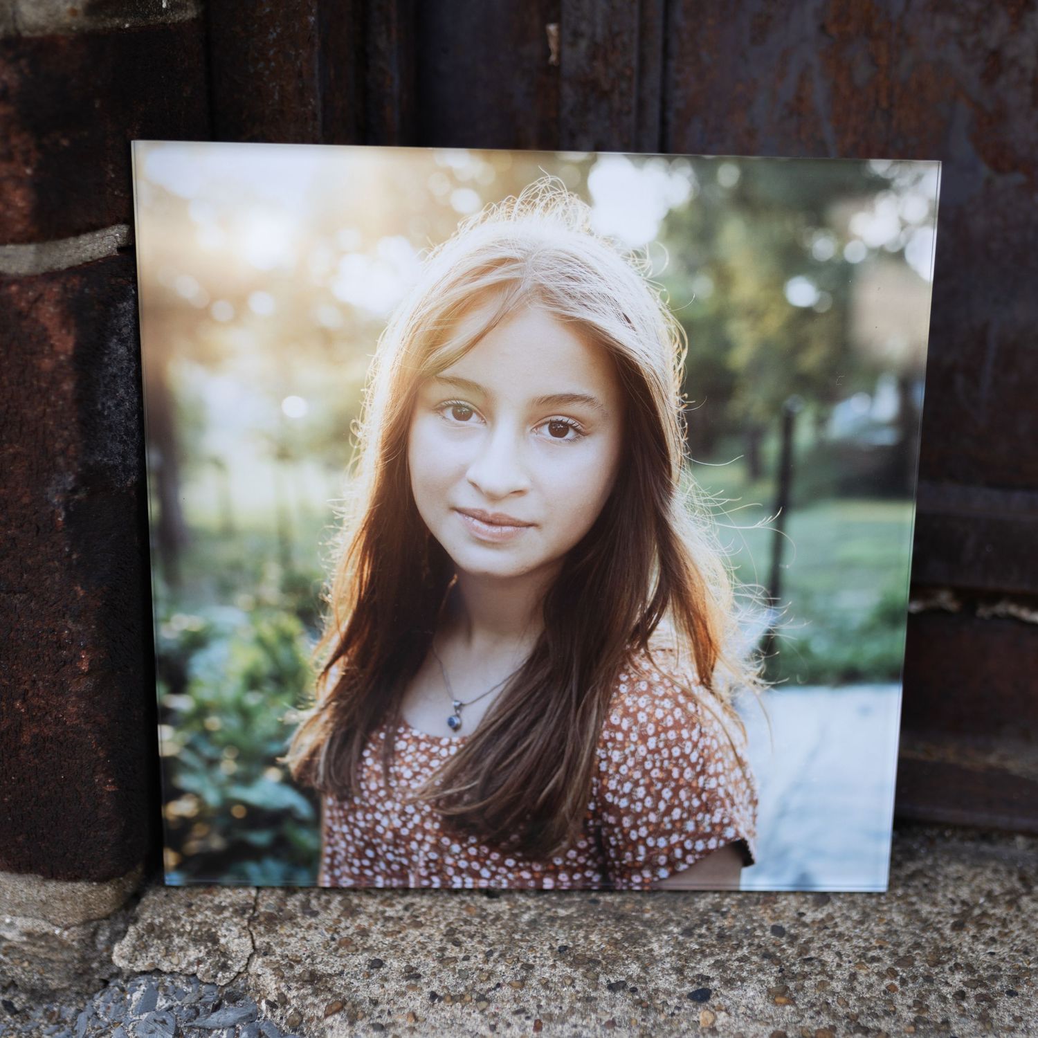 Portrait photograph displayed against rustic metal background.