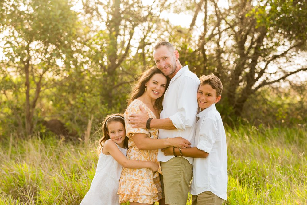 beautiful golden hour family portrait in the long grass field of dreams brisbane photographer