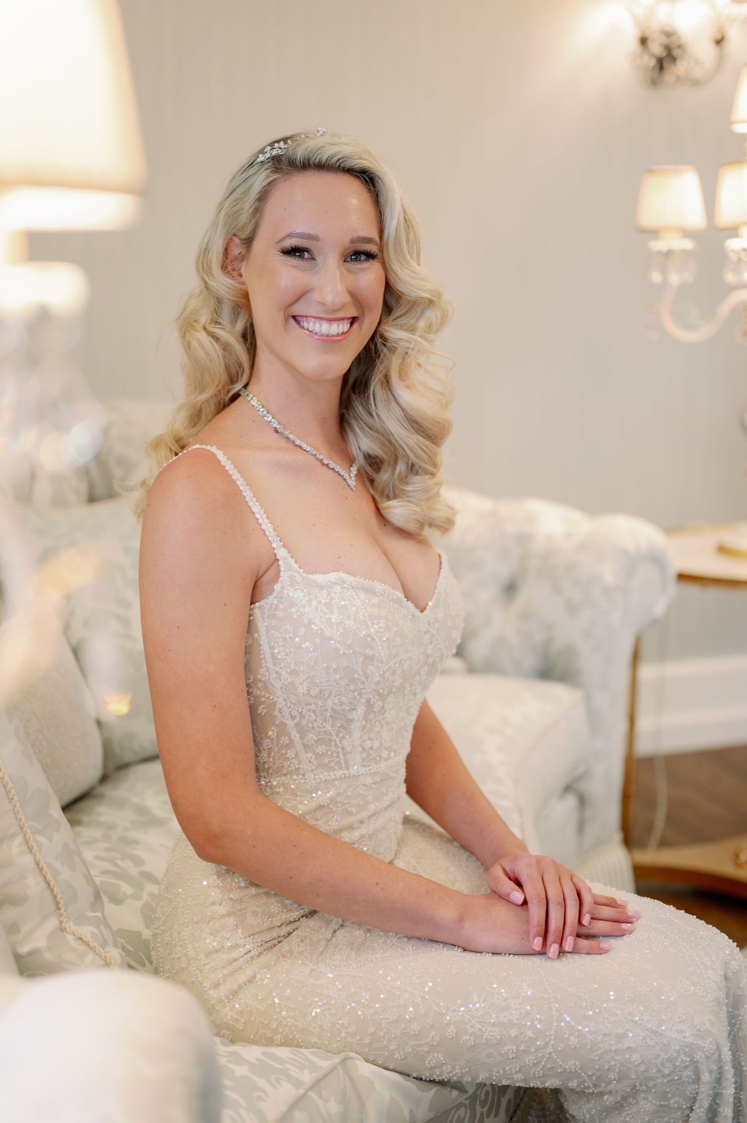 Elegant formal wear and sparkling jewelry in a sophisticated living room setting.