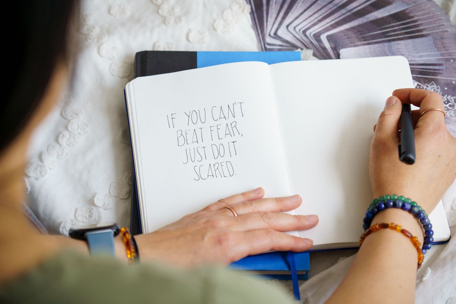 woman journaling "If you can't beat fear, just do it scared" personal branding lifestyle photo in Seattle, WA studio