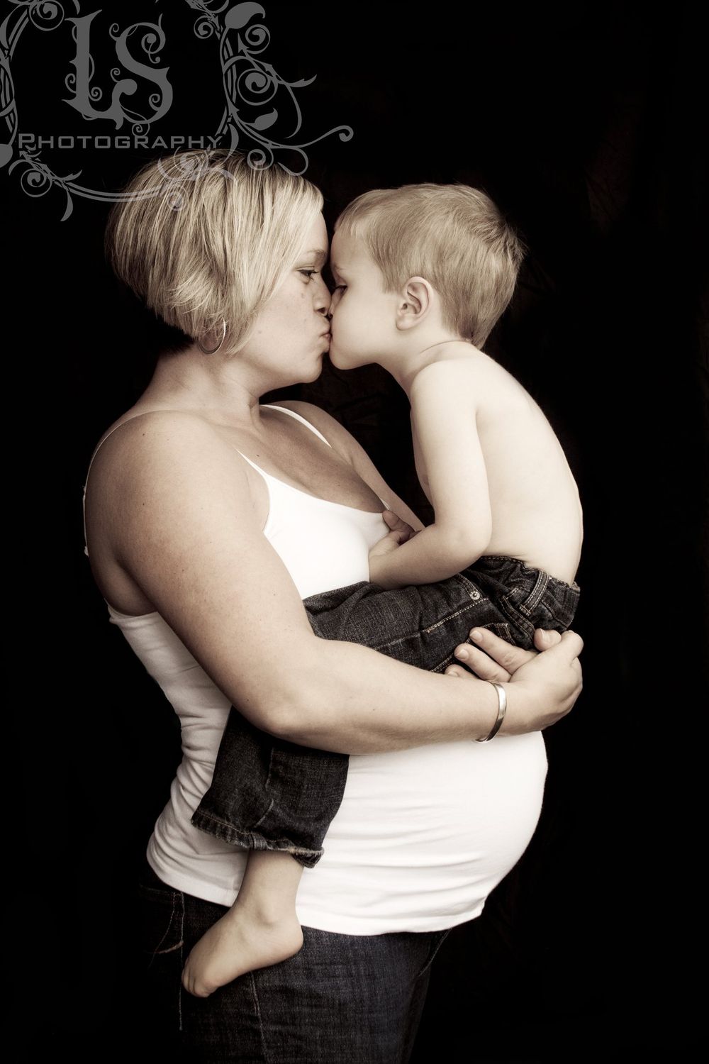 Black and white portrait series showing tender moments between parent and child.