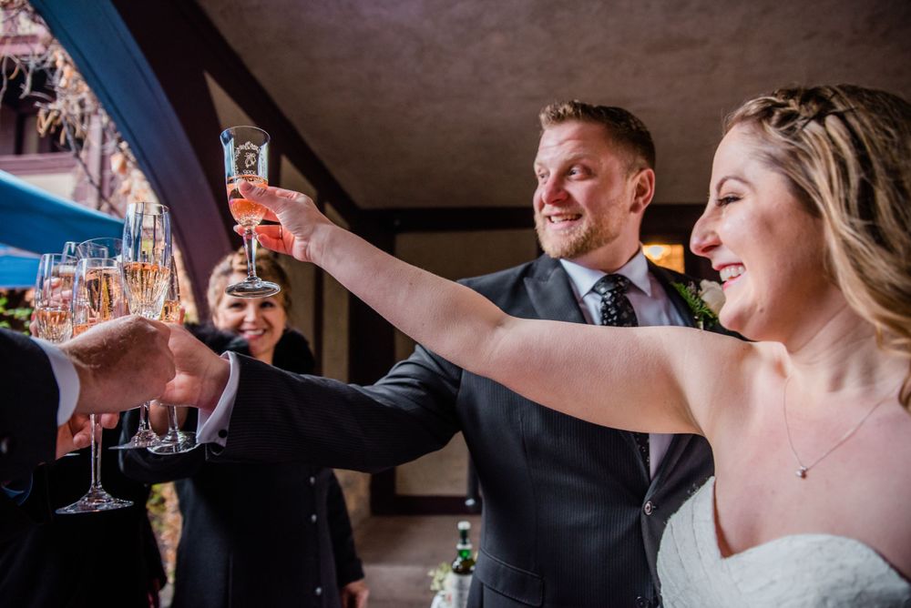 Wedding party toasts with champagne glasses during a joyous celebration.