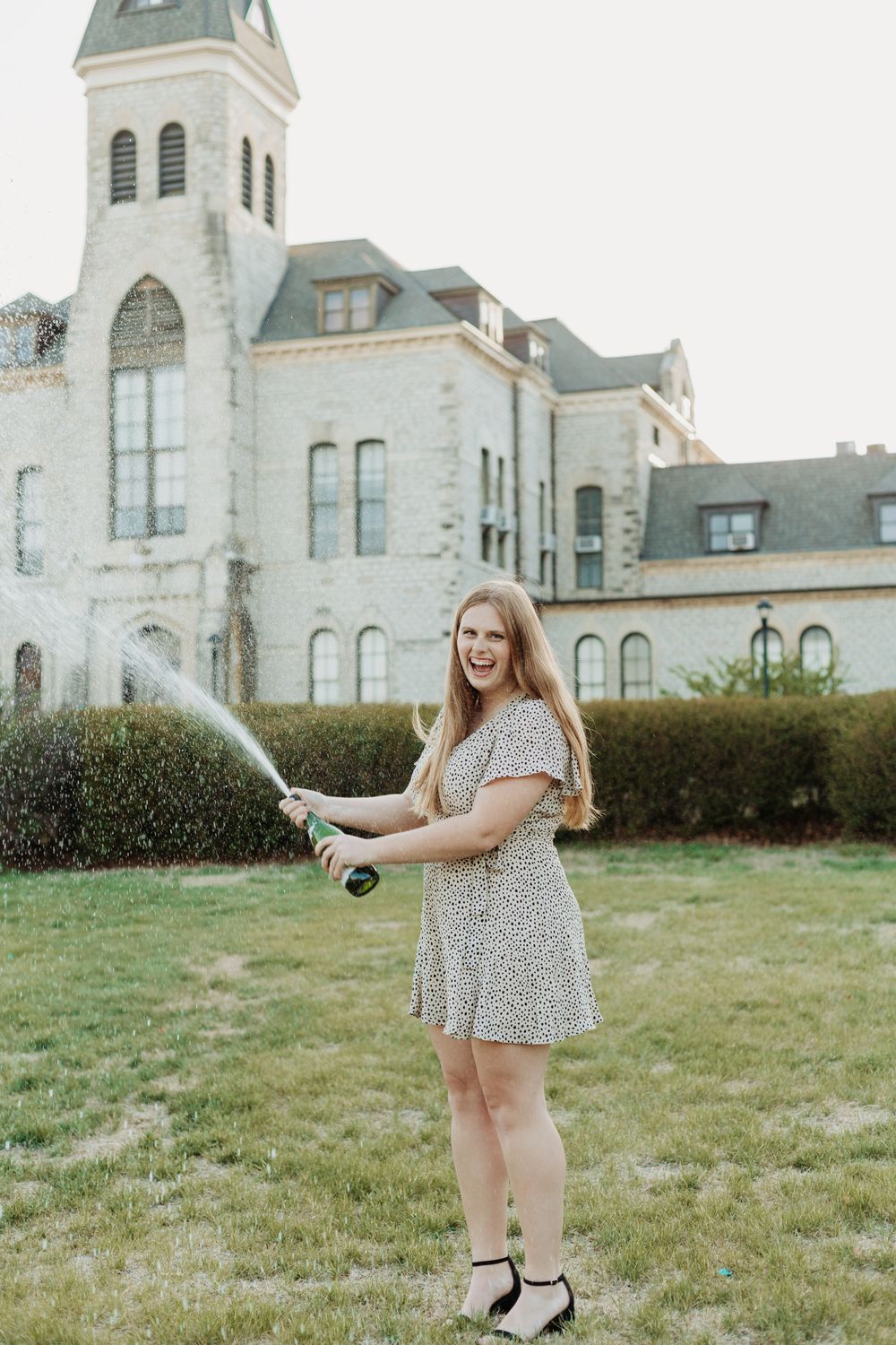 Senior photos in Manhattan, Kansas by portrait photographer – golden hour outdoor session with natural, candid senior portraits.