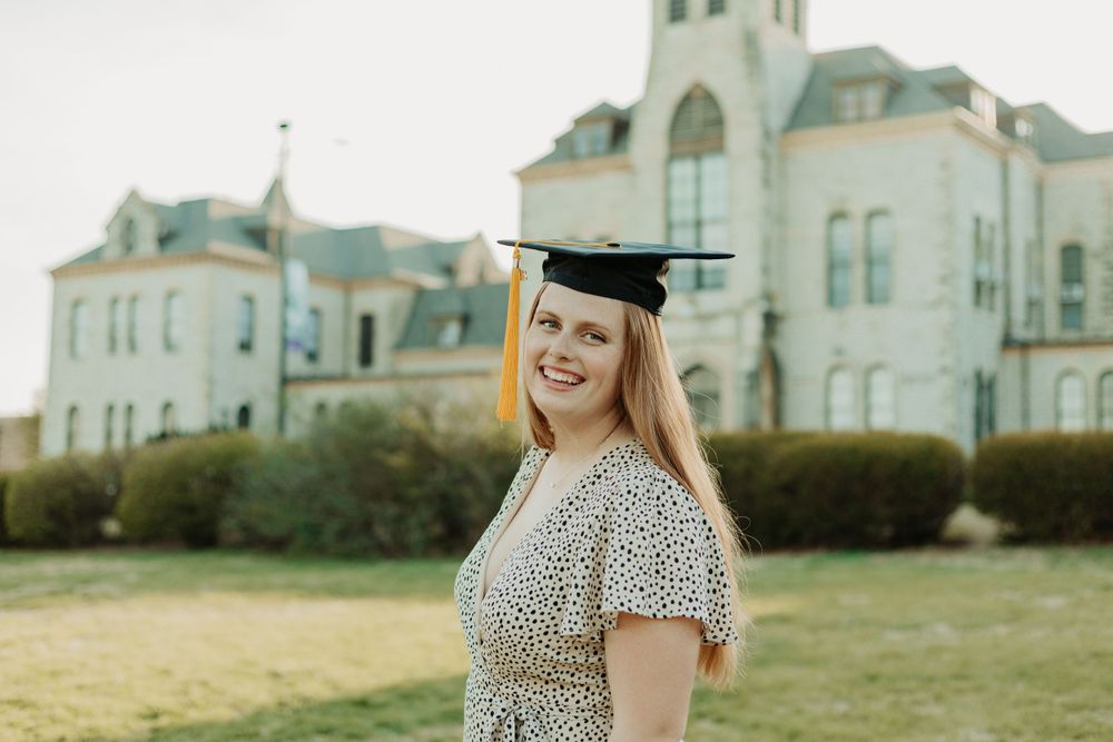 Senior photos in Manhattan, Kansas by portrait photographer – golden hour outdoor session with natural, candid senior portraits.