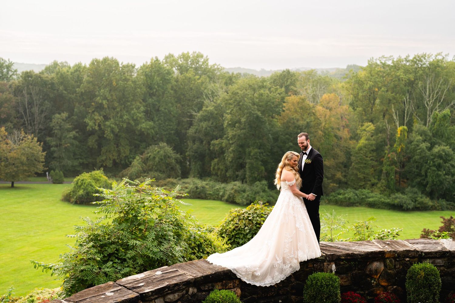 scenic photo of bride and groom at fall wedding at le chateau south Salem ny