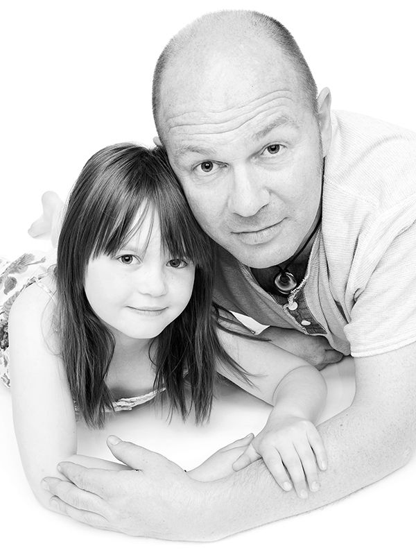 Black and white photo of father and daughter in family portrait studio High Wycombe, by  Abigail's Studio
