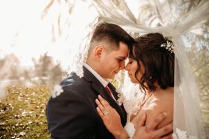 Emotional bride and groom sharing a quiet moment during their Branson wedding by Branson, MO Photographer L. Ballenger Photography.