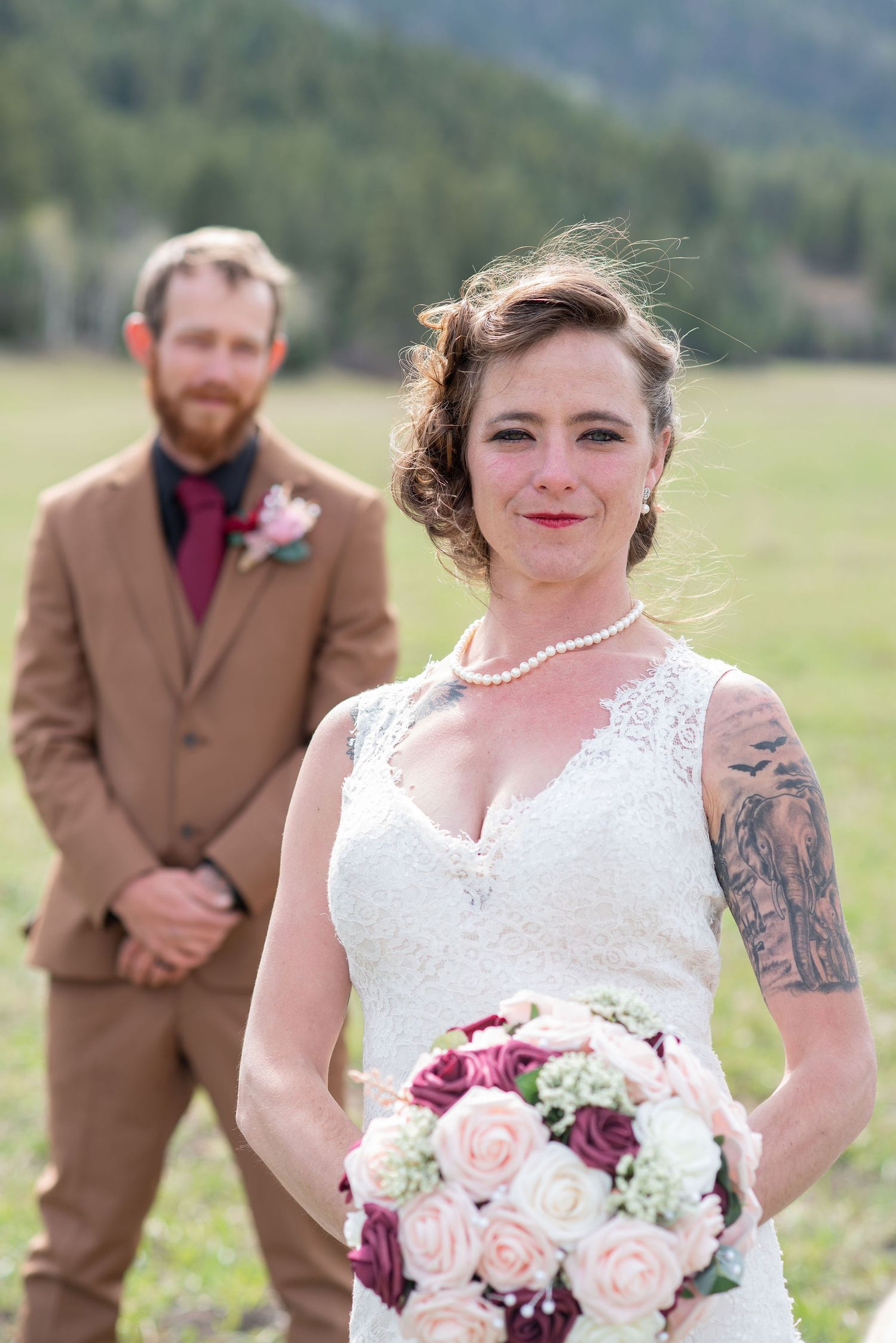 Bride with the Groom behind her