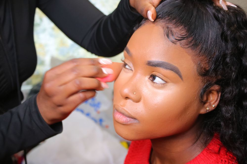 Professional makeup application being done with precision and care.
