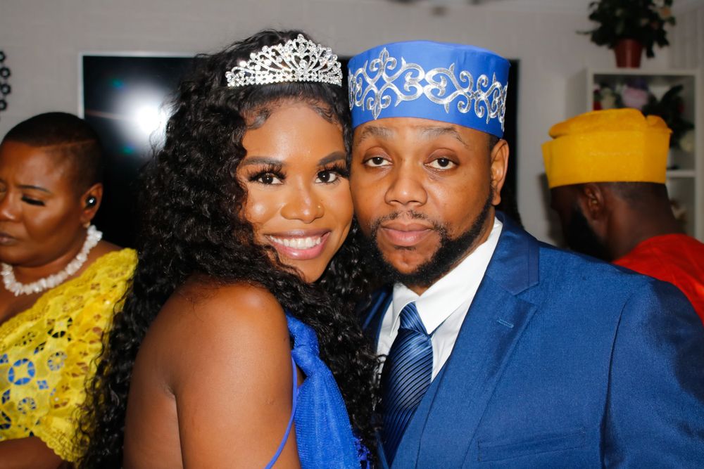Guests celebrate at an elegant event decorated in blue and white.