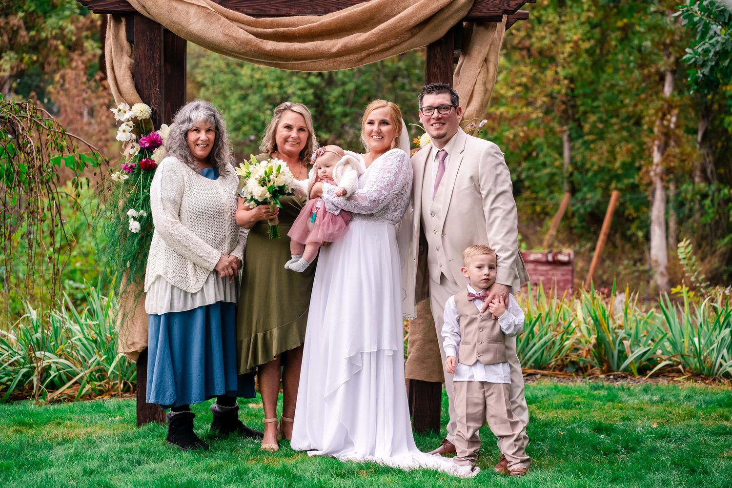 family portrait with bride and groom's moms