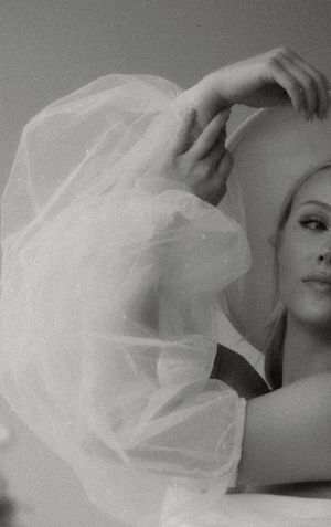 Artistic black and white close-up featuring delicate tulle fabric movement.