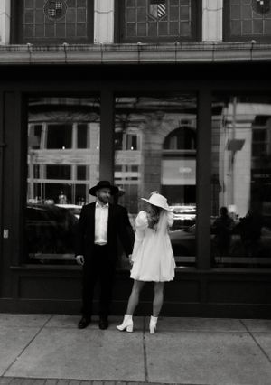 Urban photography showing vintage-inspired fashion against classic architecture.
