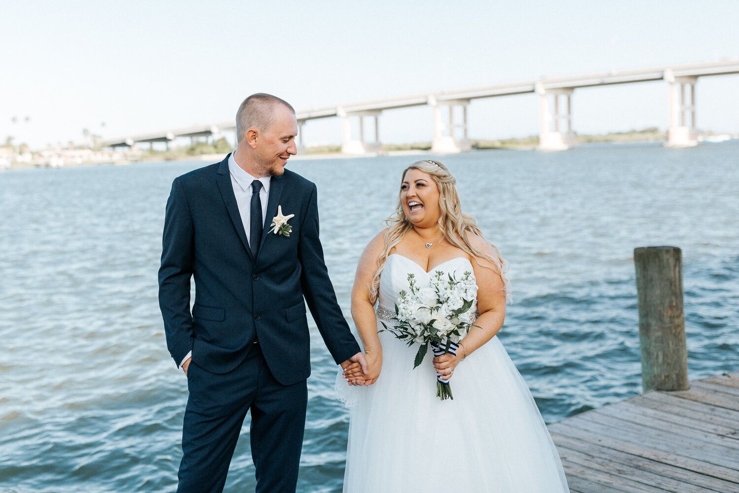 couple holding hands looking at each other