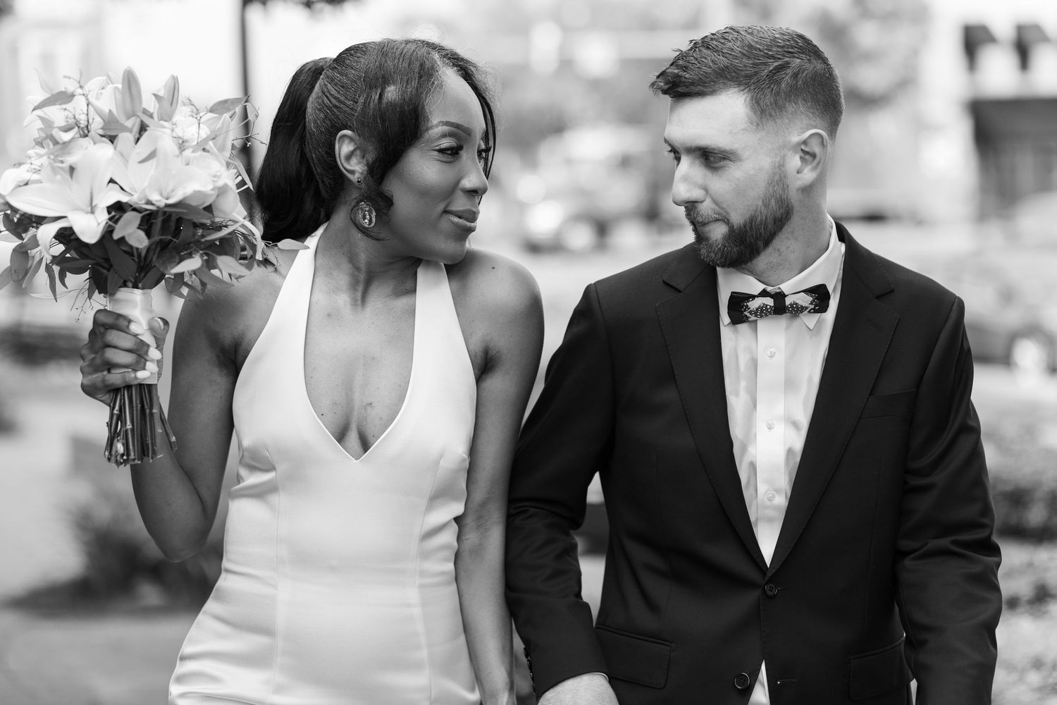Wedding day couple in love looking into each other's eyes.