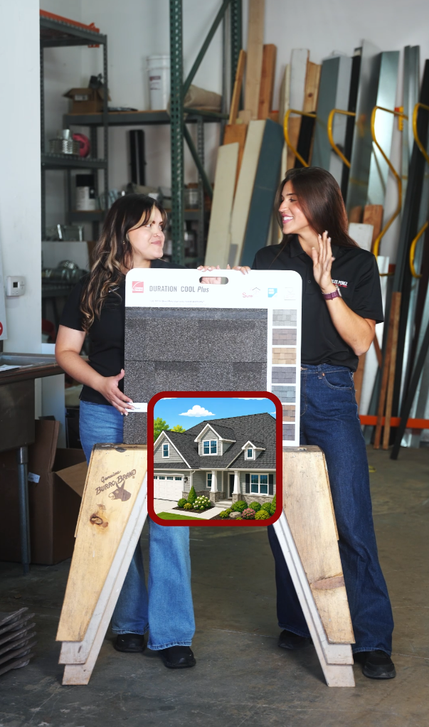Two women in a workshop display roofing shingle samples on a board with a house photo inset.