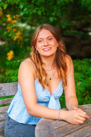 Young woman smiling at a table