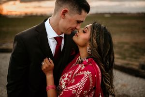Bride and groom snuggling together during sunset outside of the venue in Clarksville, TN for a portrait.