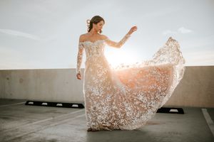 Bride tossing bridal gown during sunset in Downtown Clarksville, Tennessee.