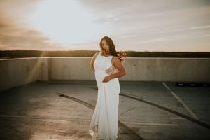 Bride on top of parking garage during sunset in downtown Clarksville, Tennessee.
