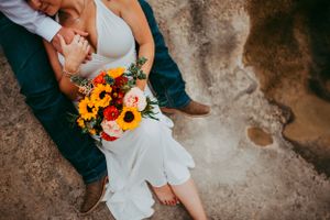 Detail shot of bridal bouquet at a river in Hill Country, Texas.