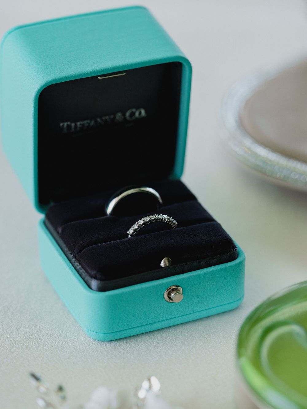 Tiffany & Co. turquoise blue ring box containing an elegant diamond ring.