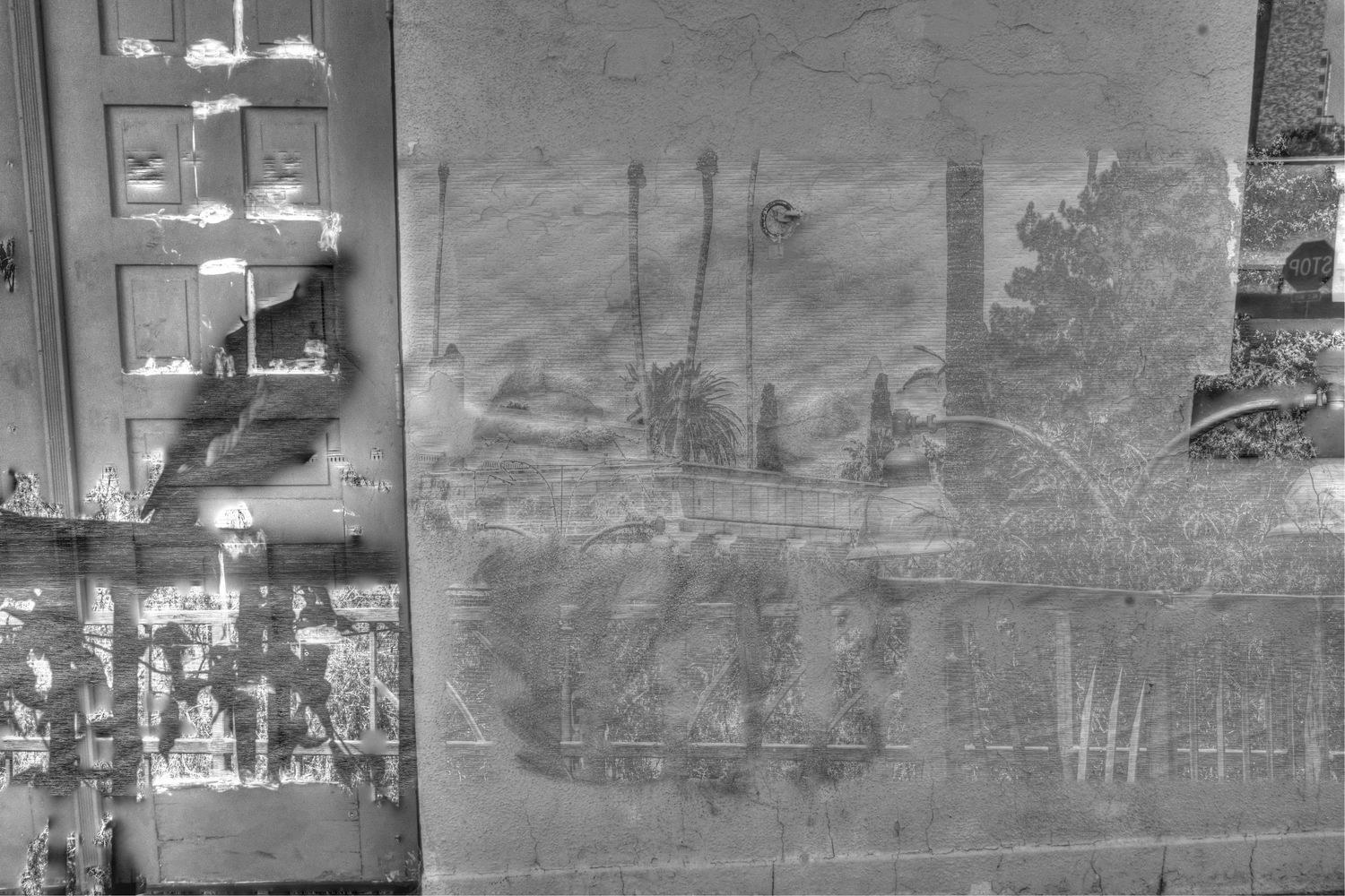 Vintage panoramic photograph of buildings and mountains in faded sepia tones.