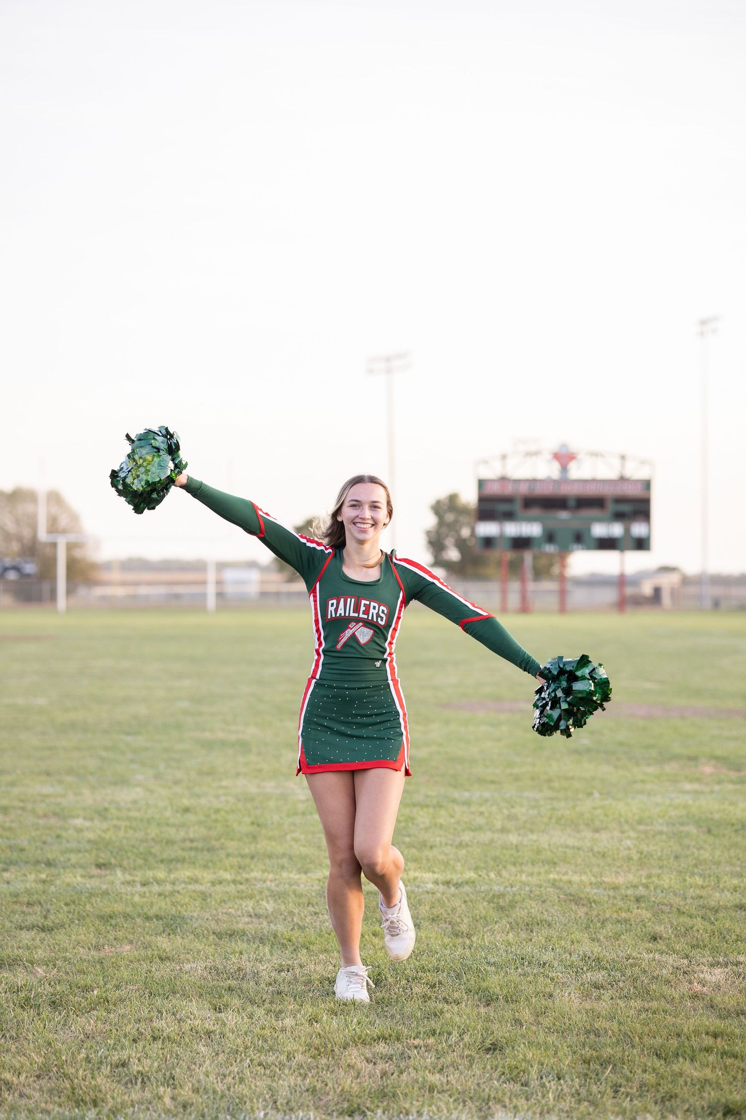 Springfield, IL senior photographer captures a senior cheerleading during a session in Central, IL