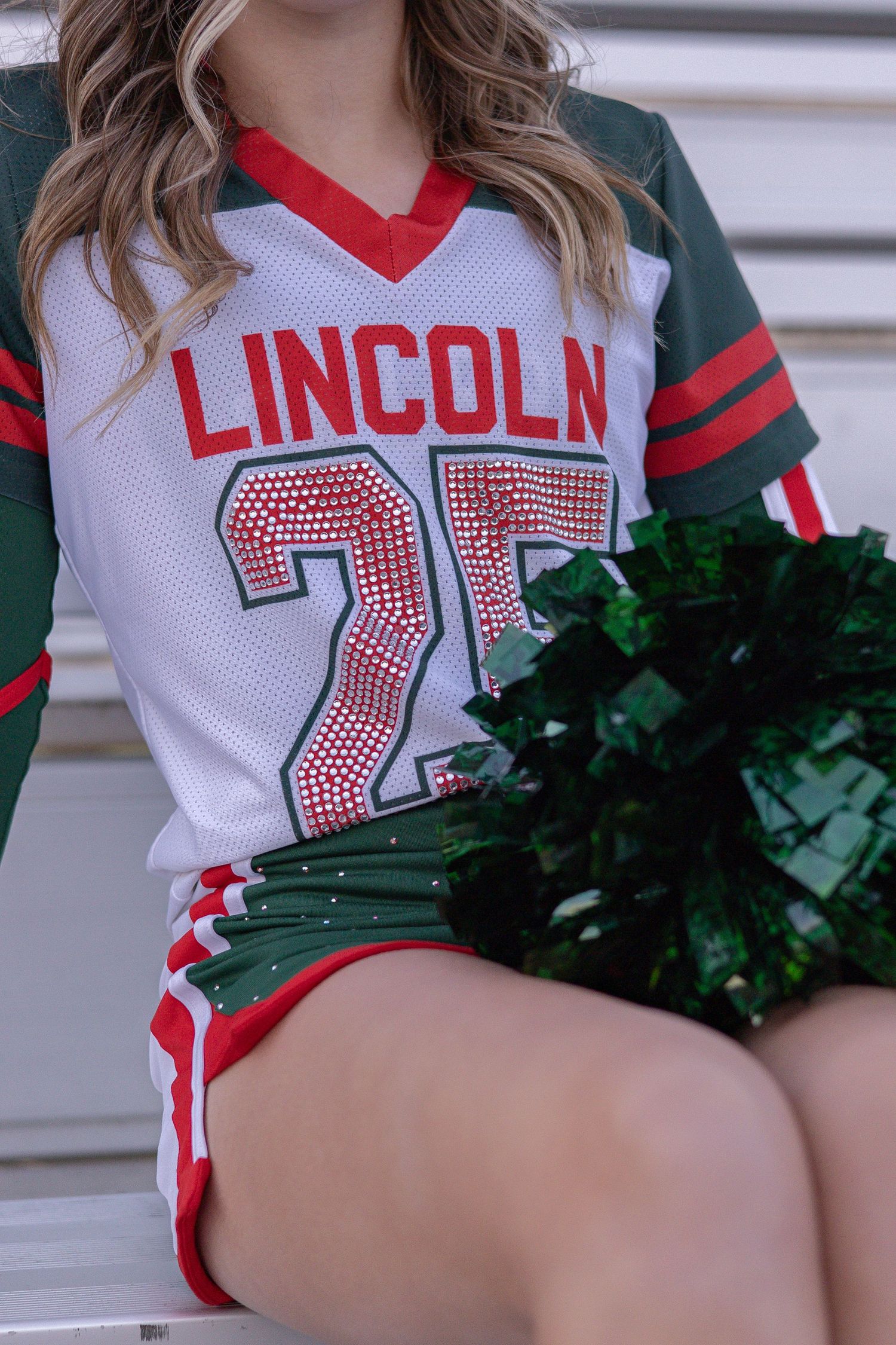 Springfield, IL senior photographer documents a senior's extracurricular cheerleading sport during a session in Central, IL