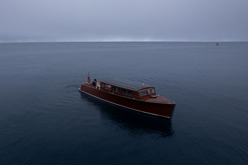 A series of photographs showing a wooden speedboat cruising across calm waters at sunset on a serene lake.
