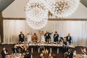Overhead view of a wedding party at the head table with elegant chandelier orbs at Grand Lodge Oaklands - taken by Grimsby photographer.