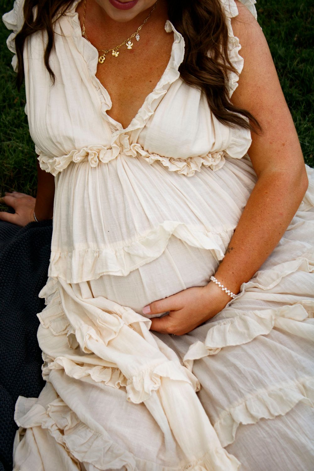 An expecting mother during a maternity photo session at Willow Tree Park in Canyon, Texas