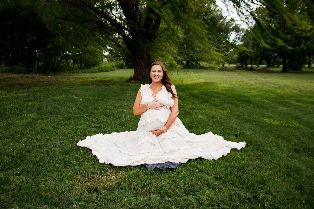 An expecting mother during a maternity photo session at Willow Tree Park in Canyon, Texas