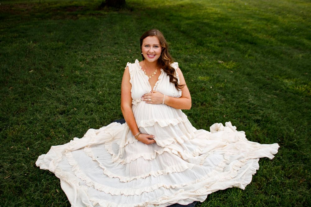 An expecting mother during a maternity photo session at Willow Tree Park in Canyon, Texas