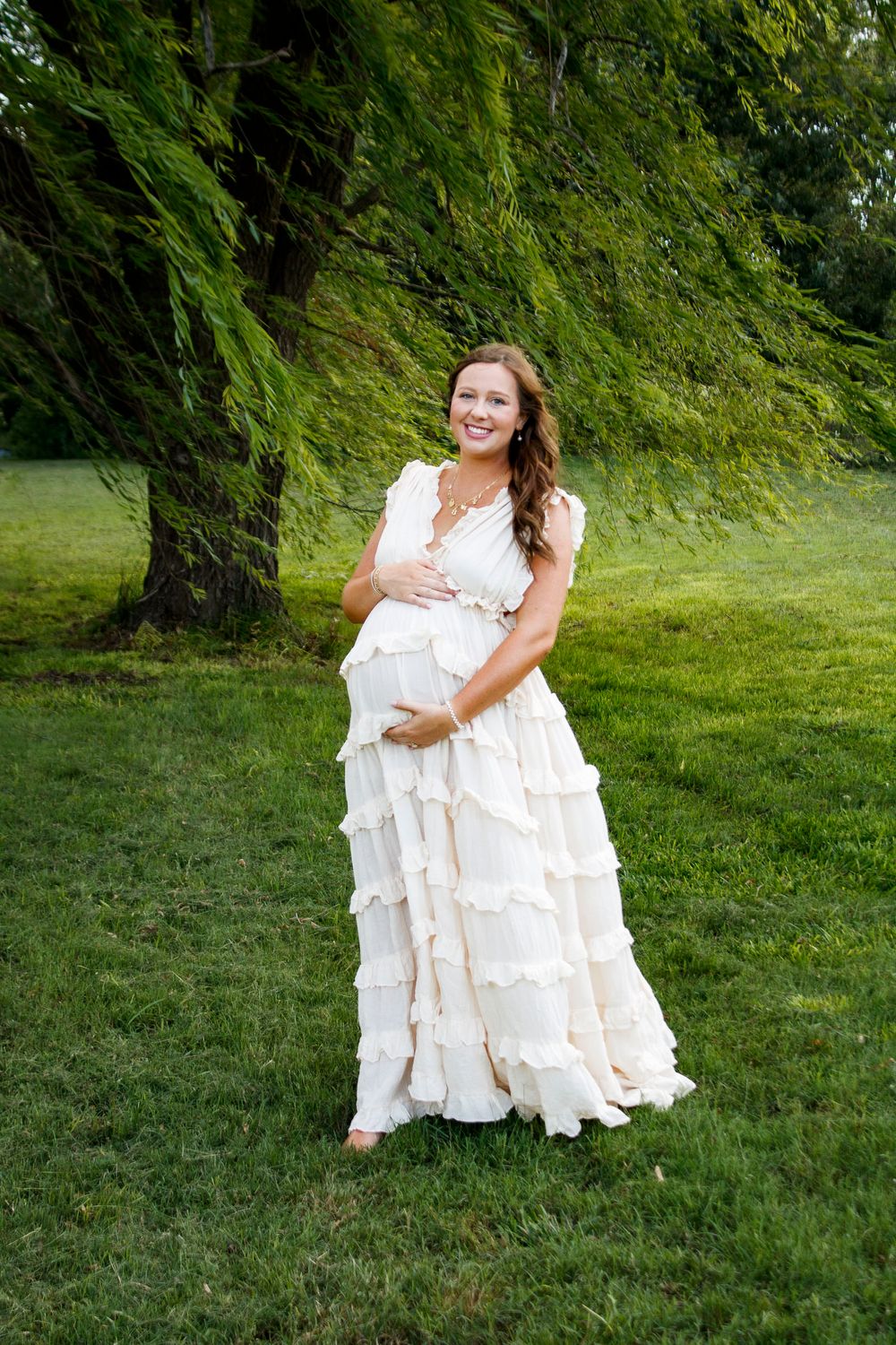 An expecting mother during a maternity photo session at Willow Tree Park in Canyon, Texas