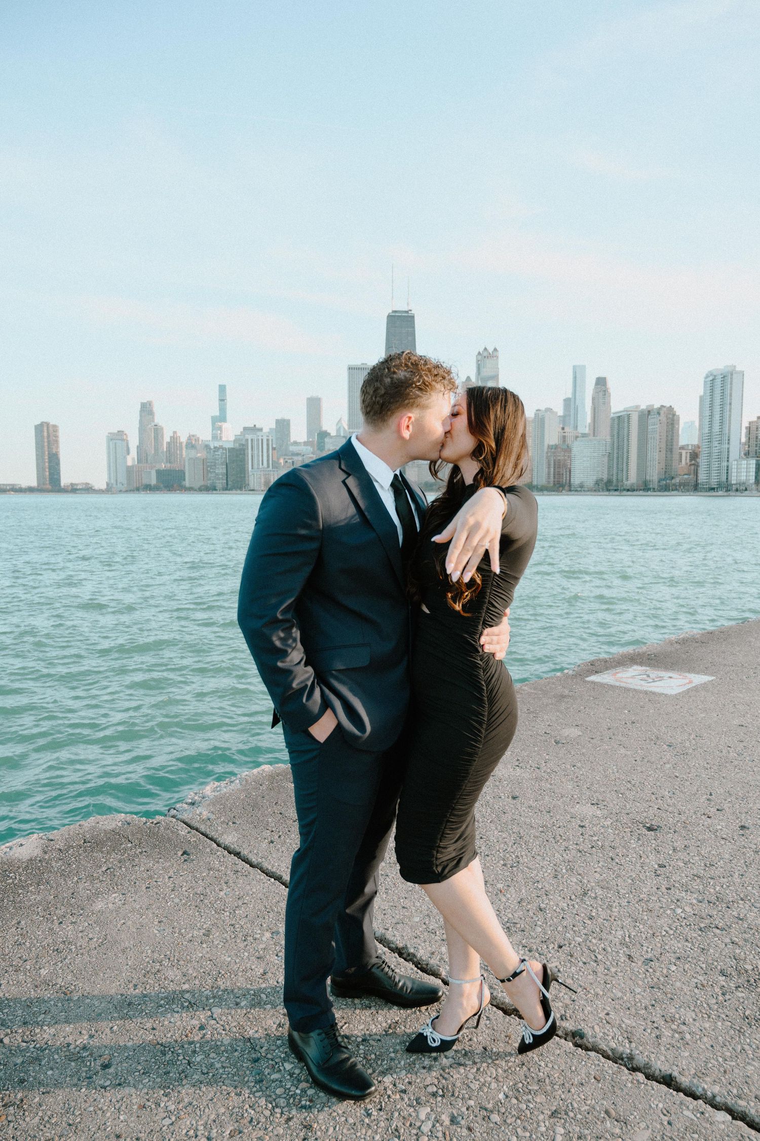A proposal sequence with Chicago skyline as backdrop shows kneeling figure and their partner in multiple frames.