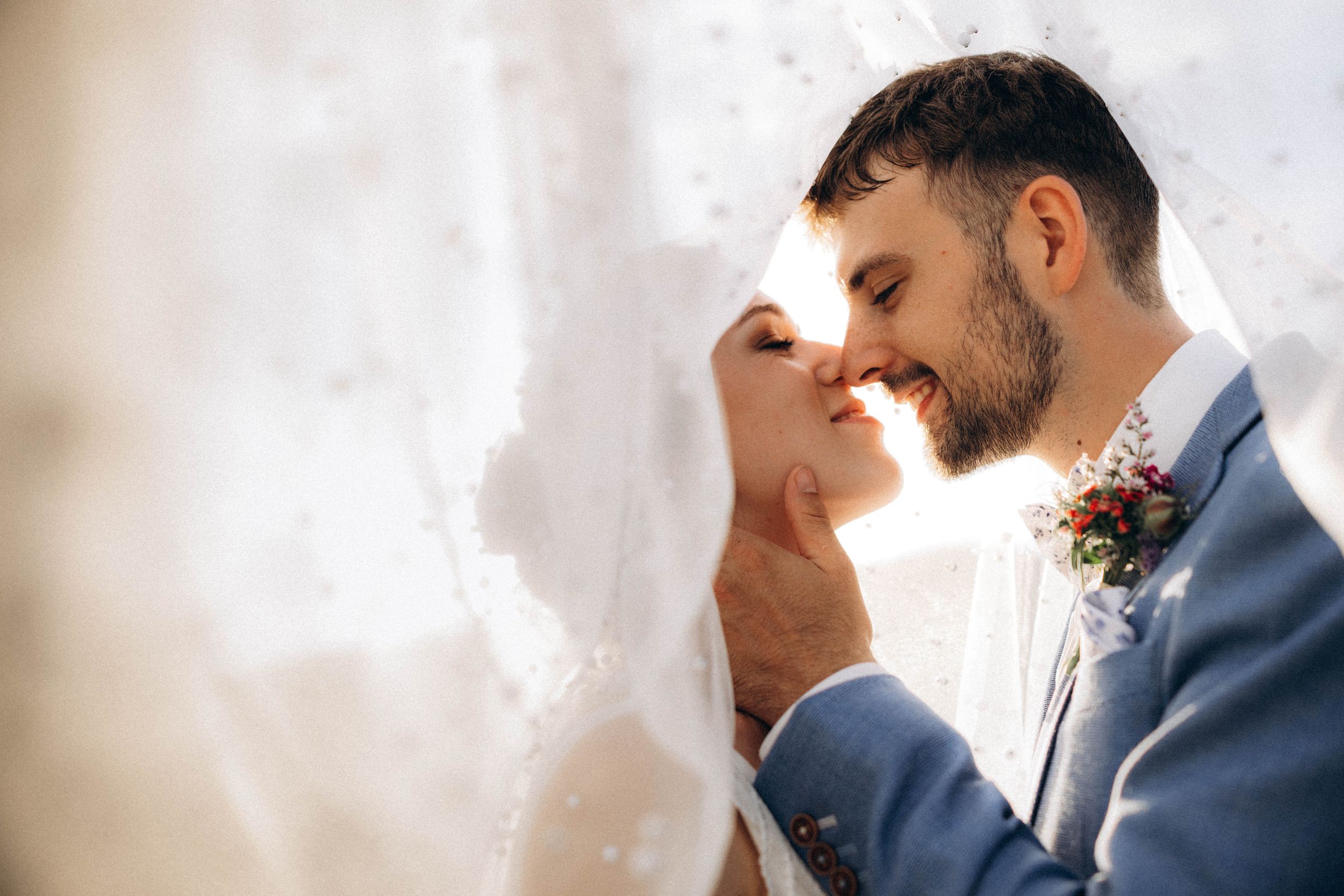 A romantic dance silhouette under stone archways with warm lighting.