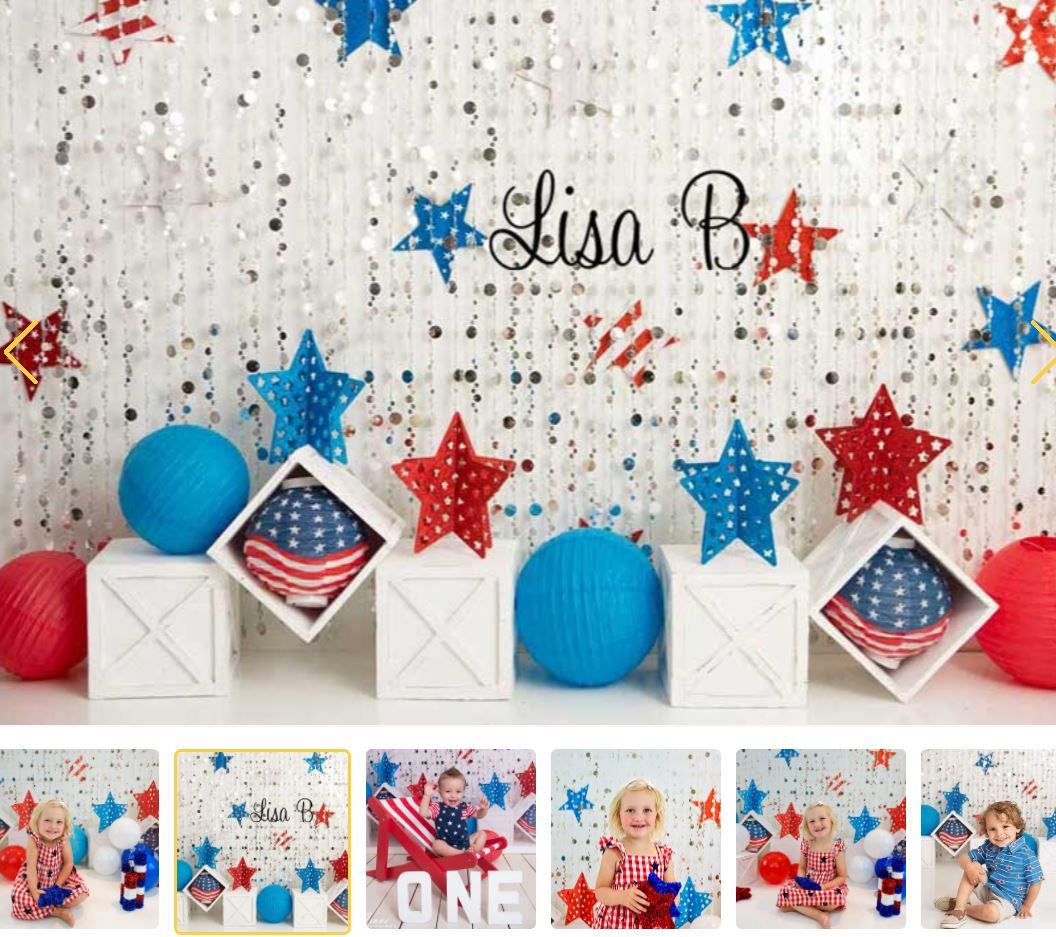 Patriotic photo backdrop with red, white, blue stars, American flag decorations, and white boxes for Fourth of July celebration.