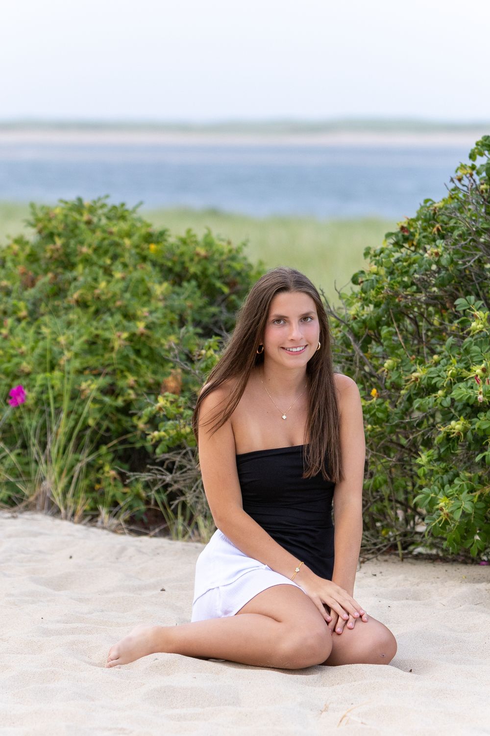 High school senior photos on Chatham Lighthouse Beach on Cape Cod for her senior yearbook portrait photos.  High school senior photographer.