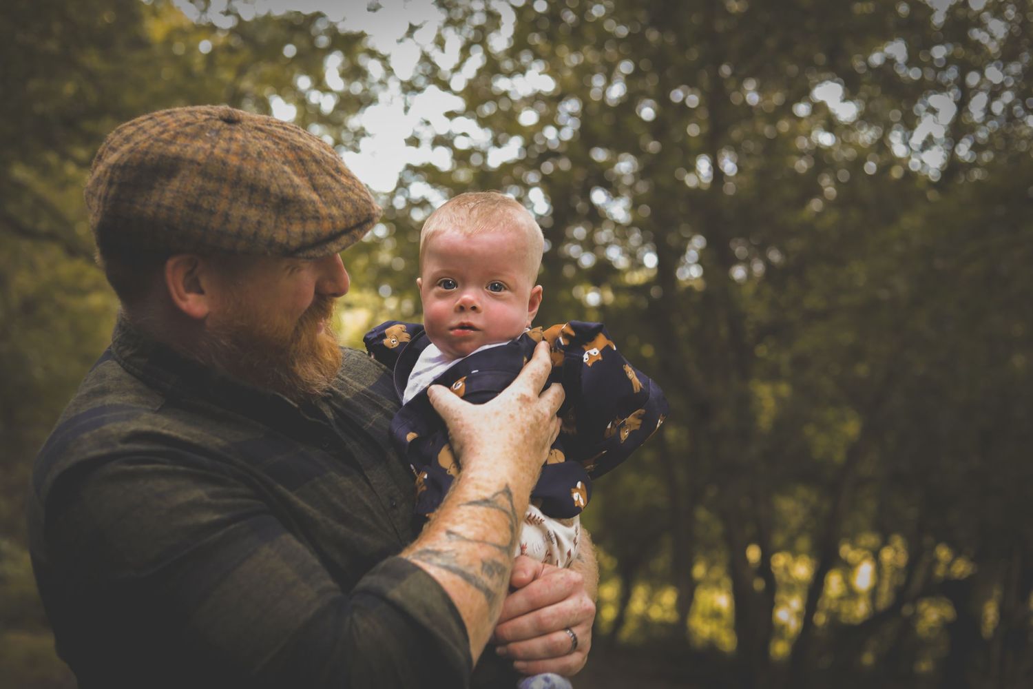 Outdoor autumn portrait in park with plaid cap and warm clothing.