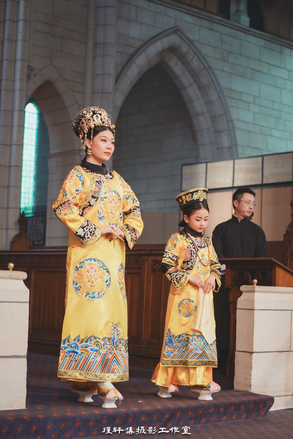 Group of elegant models showcasing beautiful Qipao dresses at a cathedral fashion event, by an Auckland photographer.