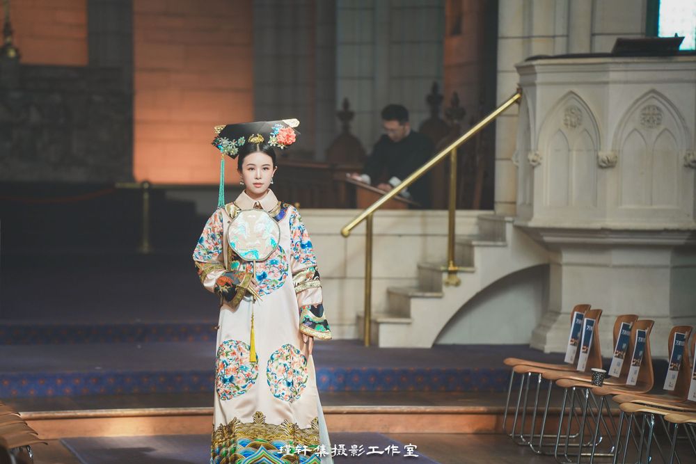 Group of elegant models showcasing beautiful Qipao dresses at a cathedral fashion event, by an Auckland photographer.